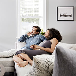 Mortgage paperwork with home keys laying on a calculator